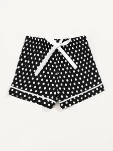 Black and white polka dot detail showing cute bow and smooth fabric trim for comfy home shorts.