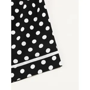 Black polka dot pajama shorts with white trim showcasing soft breathable homewear style design.