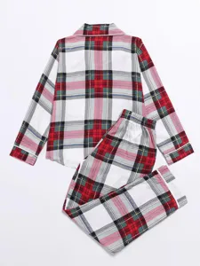 Classic red and green plaid pajama set detail, comfortable long sleeves and matching pants.