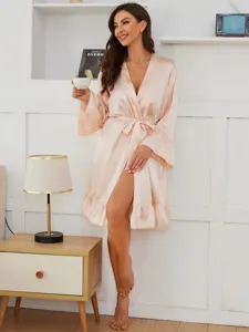 Chic silk-like long sleeve sleep robe detail, soft pink nightgown with elegant ruffles.