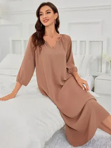 Comfortable long sleeve V-neck loungewear dress detail showcasing soft texture and relaxed fit.