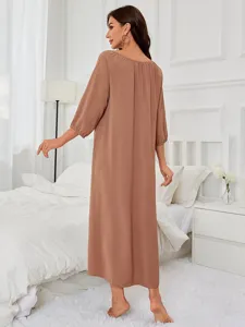 Details view of comfortable brown long sleeve nightwear dress, casual home wear style.