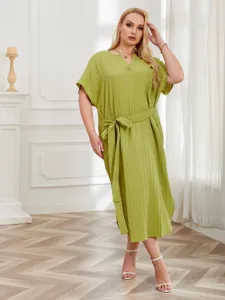 Detailed view of the plus size pleated lounge dress showcasing V-neckline and elegant belt.