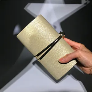 Elegant gold evening clutch bag with sleek metal accent bar for women parties weddings