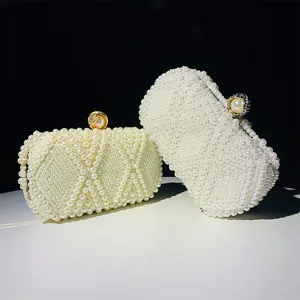 Elegant handmade pearl evening clutch bag featuring a chic diamond lattice pattern and clasp.