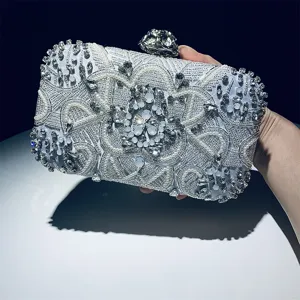 Elegant handcrafted beaded evening clutch bag with sparkling rhinestones and pearls.