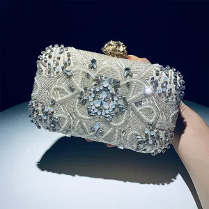 Handcrafted beaded evening clutch detail shot featuring exquisite rhinestones and lock.
