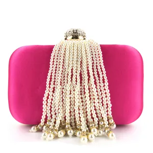 Stunning pink satin pearl evening clutch bag with cascading tassel and rhinestone clasp.