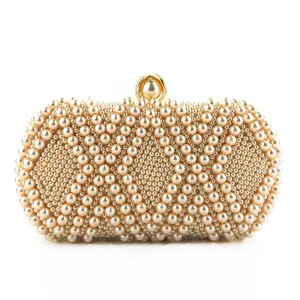 Exquisite handmade pearl evening clutch bag detail, elegant beaded texture for formal events.