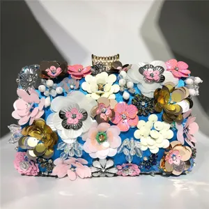Detailed shot of a stunning blue handmade sequin beaded flower evening clutch bag.