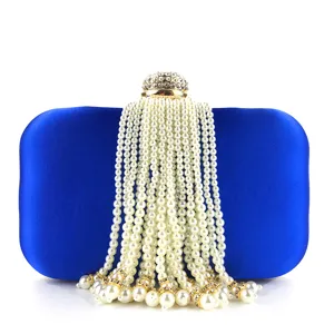Blue satin pearl tassel evening clutch bag detail, exquisite rhinestone clasp design.