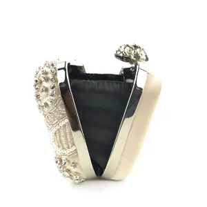 Stunning beaded rhinestone evening clutch bag with satin finish and metal frame for wedding party.
