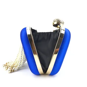 Blue satin evening clutch bag with gold metal frame, rhinestone clasp and pearl tassels detail.