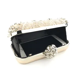 Detailed view of champagne beaded evening clutch open with phone inside, exquisite rhinestone decor.