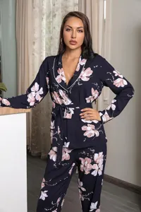 Close-up of women's long sleeve floral pajama set featuring a chic belt and contrast collar.