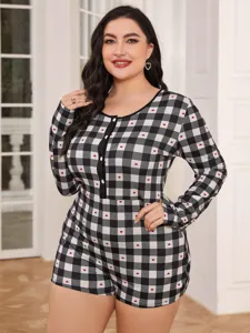 Plus size long sleeve pajama romper detail, black and white plaid with cute red hearts pattern.