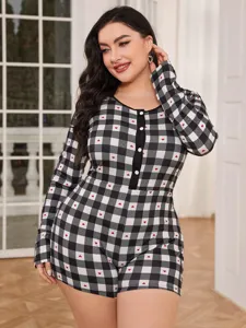 Plus size black white plaid onesie with cute red hearts, long sleeves, front button detail.