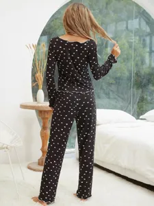 Women black heart print long sleeve pajamas set detail view, comfortable nightwear for autumn.