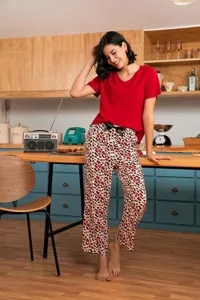 Detailed view of women's short sleeve sleepwear set in red and leopard print design.