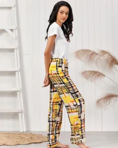 Detailed view of women's casual loungewear set, featuring yellow plaid pants and white top.