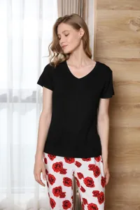 Detailed view of women summer sleepwear set, black v-neck short sleeve top and floral pants.