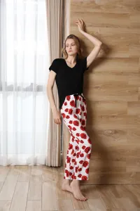 Detailed view of women's short-sleeve pajama set featuring floral print pants and comfortable top.