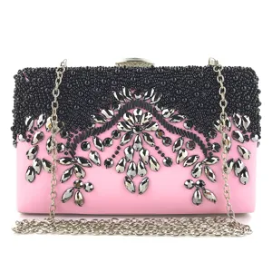 Pink evening clutch bag featuring handmade black bead embroidery and silver chain strap.