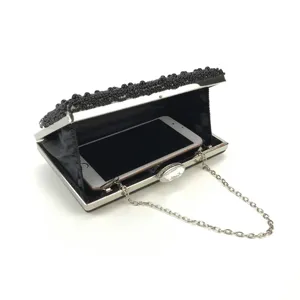 Black handmade beaded evening clutch bag with metal chain and crystal clasp for women.