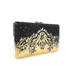 Exquisite evening clutch bag with black beads and silver rhinestones on gold base.