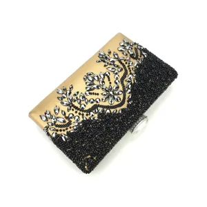 Gold and black beaded evening clutch detail with sparkling crystals and fine handmade beads.