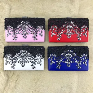 Detailed view of handmade beaded evening clutch bags in multi-colors with rhinestones.