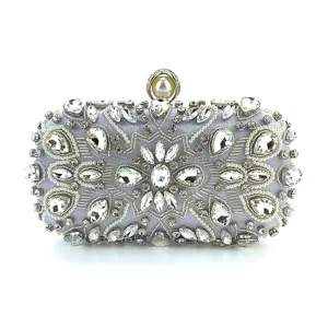 Exquisite silver rhinestone beaded evening clutch bag with elegant pearl closure detail.