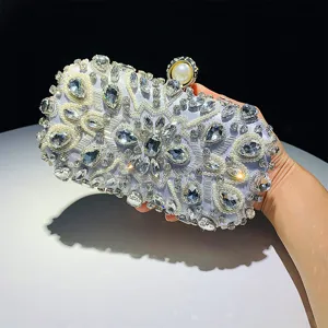 Stunning rhinestone evening clutch bag with handcrafted beading, pearls, and elegant clasp.