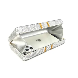 Rhinestone crystal evening clutch bag detail showing interior space and sparkling diamond finish.
