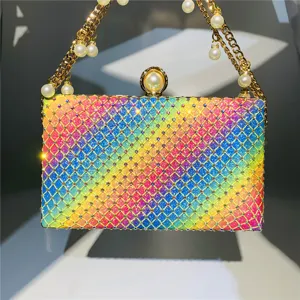 Sparkling rainbow rhinestone clutch detail showing vibrant crystal mesh design with pearls.