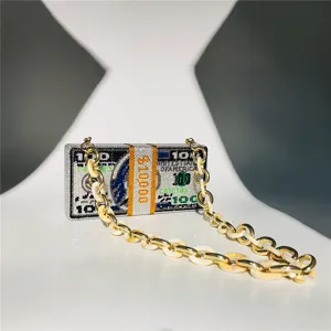 Exquisite rhinestone dollar bill clutch bag detail showing sparkling crystal craftsmanship.