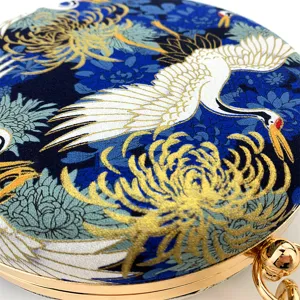 Elegant round evening bag with crane and chrysanthemum print, gold metal frame, luxury clutch.