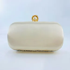Elegant champagne satin evening clutch bag with pearl metal clasp for women wedding party.