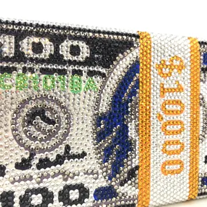 Detailed view of rhinestone money clutch bag, sparkling crystal dollar bill design.