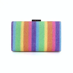 Close-up detail of the colorful rainbow glitter clutch bag showing vibrant stripe pattern.