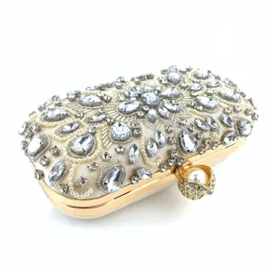 Crystal rhinestone evening clutch bag detail, sparkling diamond embellishment, gold frame.