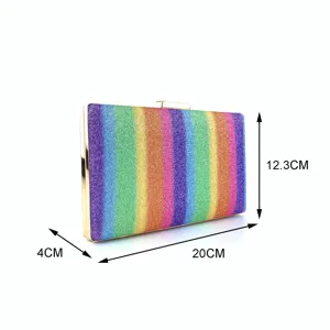 Close-up detail of the rainbow sequin clutch bag showing colorful glitter and gold frame.