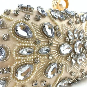 Handmade rhinestone evening clutch bag detail shot, elegant beaded purse for women parties.