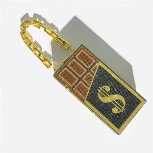 Luxury rhinestone chocolate dollar clutch bag detail, sparkling crystal evening bag with gold chain.