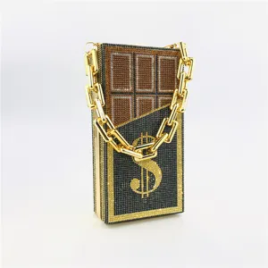 Luxurious rhinestone chocolate dollar clutch bag, sparkly crystal evening handbag with gold chain.