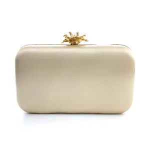 Elegant champagne satin evening clutch bag with exquisite gold floral clasp for wedding party.