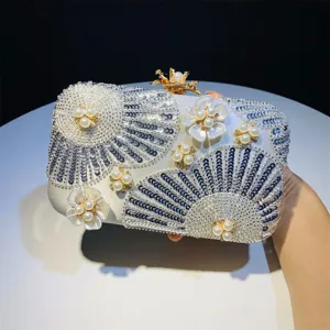 Detailed view of the elegant beaded pearl clutch bag with floral sequin design for evening events.