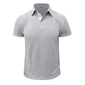 Close-up detail of grey short sleeve cotton polo shirt, featuring collar and placket.