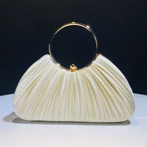 Satin pleated evening clutch bag with elegant gold ring handle, perfect party accessory.