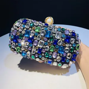 Handmade rhinestone evening clutch bag detail, vibrant colorful gems and elegant pearl clasp.